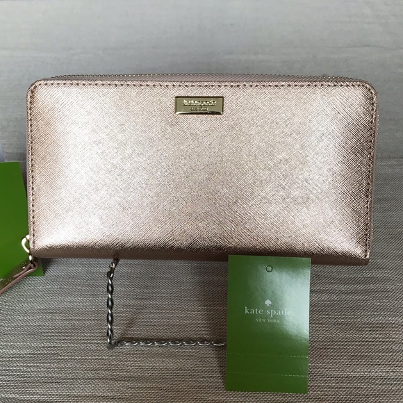 kate spade Handbags - Kate Spade Neda Rose Gold Leather Zip Wallet